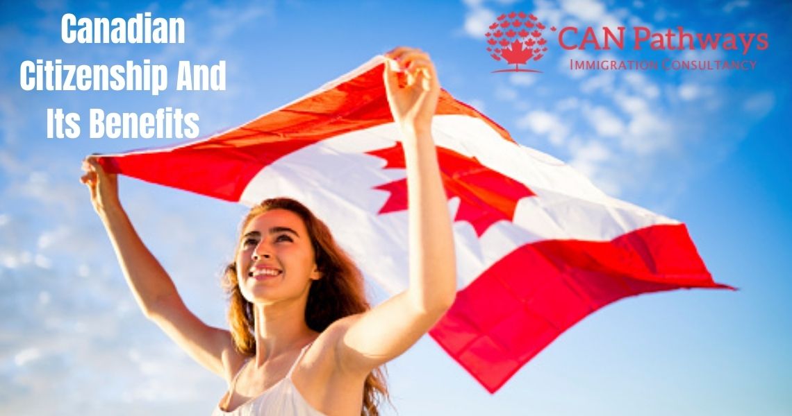 A women holding the Canadian Flag in her hands